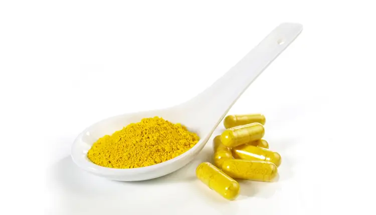 berberine supplement in yellow powder in vegan capsule